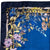 Laura Biagiotti scarf with floral and belt design on a blue background
