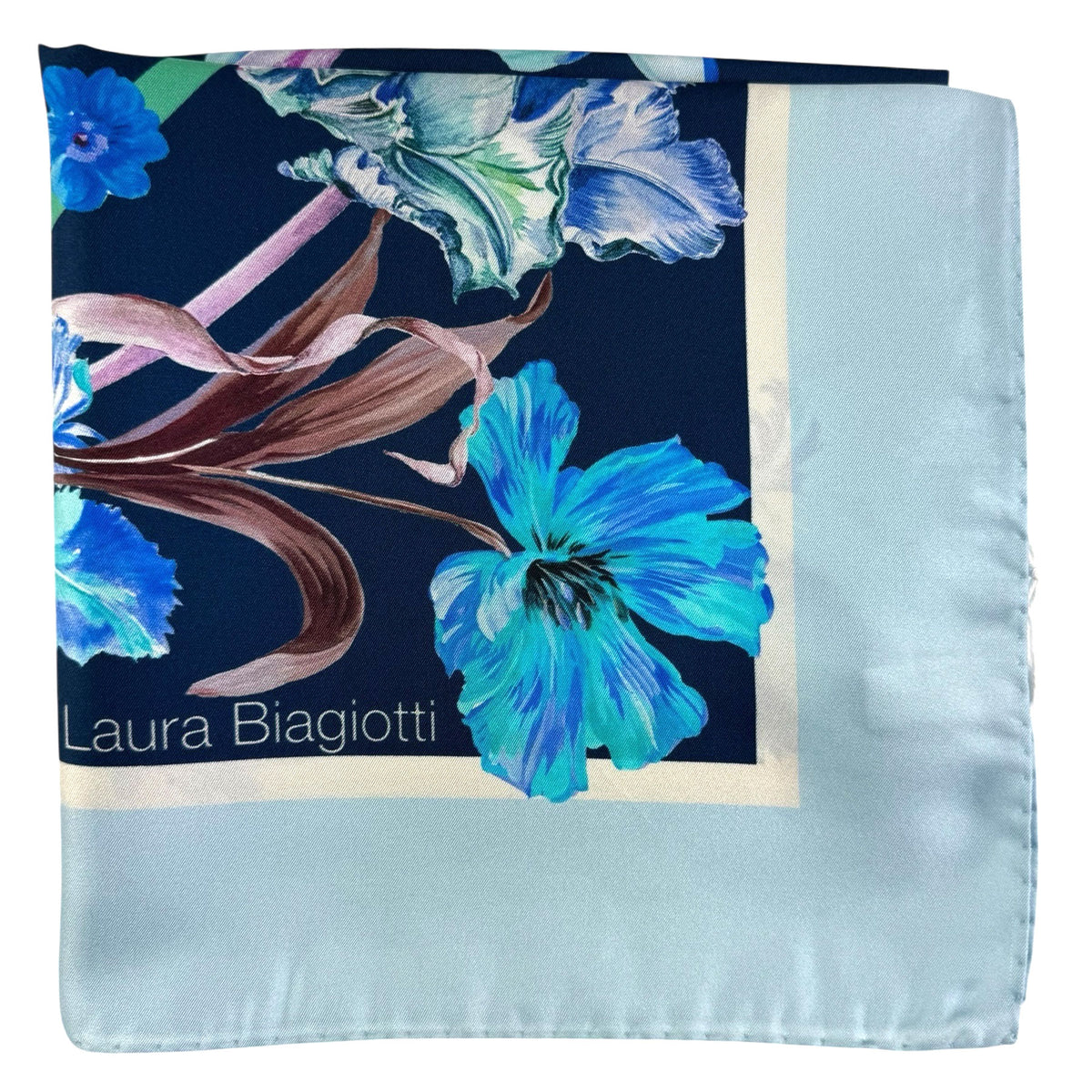 Floral patterned fabric with &#39;Laura Biagiotti&#39; branding on a white background